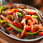 carne de sol acebolada com pimentas